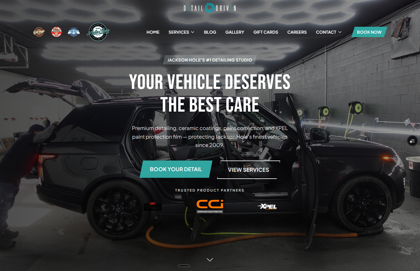 Detail Driven Auto Spa website hero showing unified dark luxury design and electric teal booking CTA